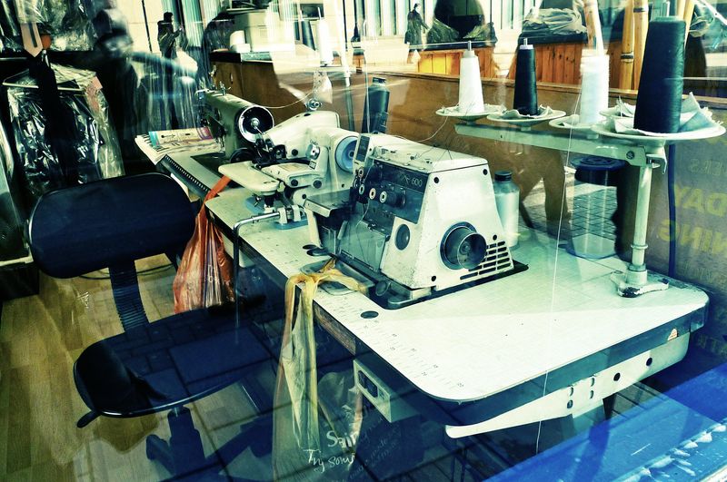 A photo of a sewing machine in a London dry cleaners
